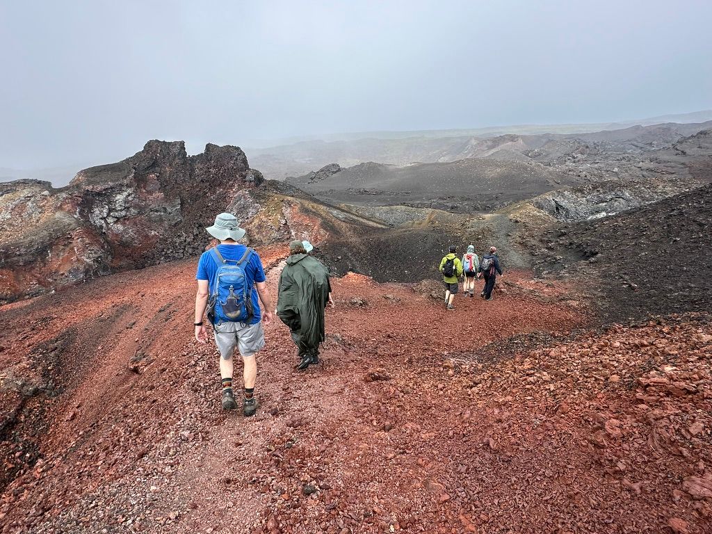 Hikers crossing the lava fields of Sierra Negra volcano, Galápagos